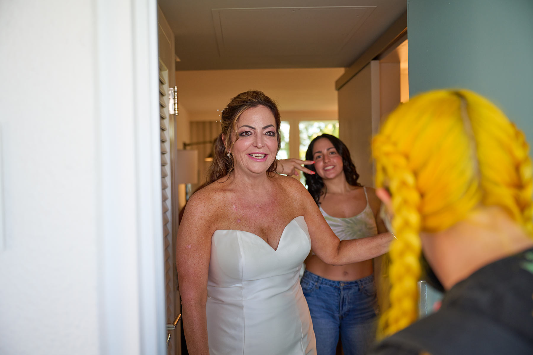 Bride-getting-ready-with-daughter-before-wedding