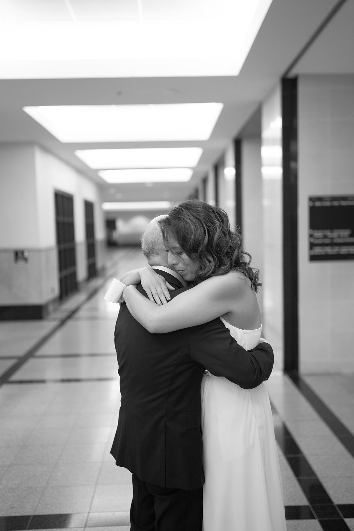 Bride-hugging-her-gather-at-City-Hall-wedding-ceremony