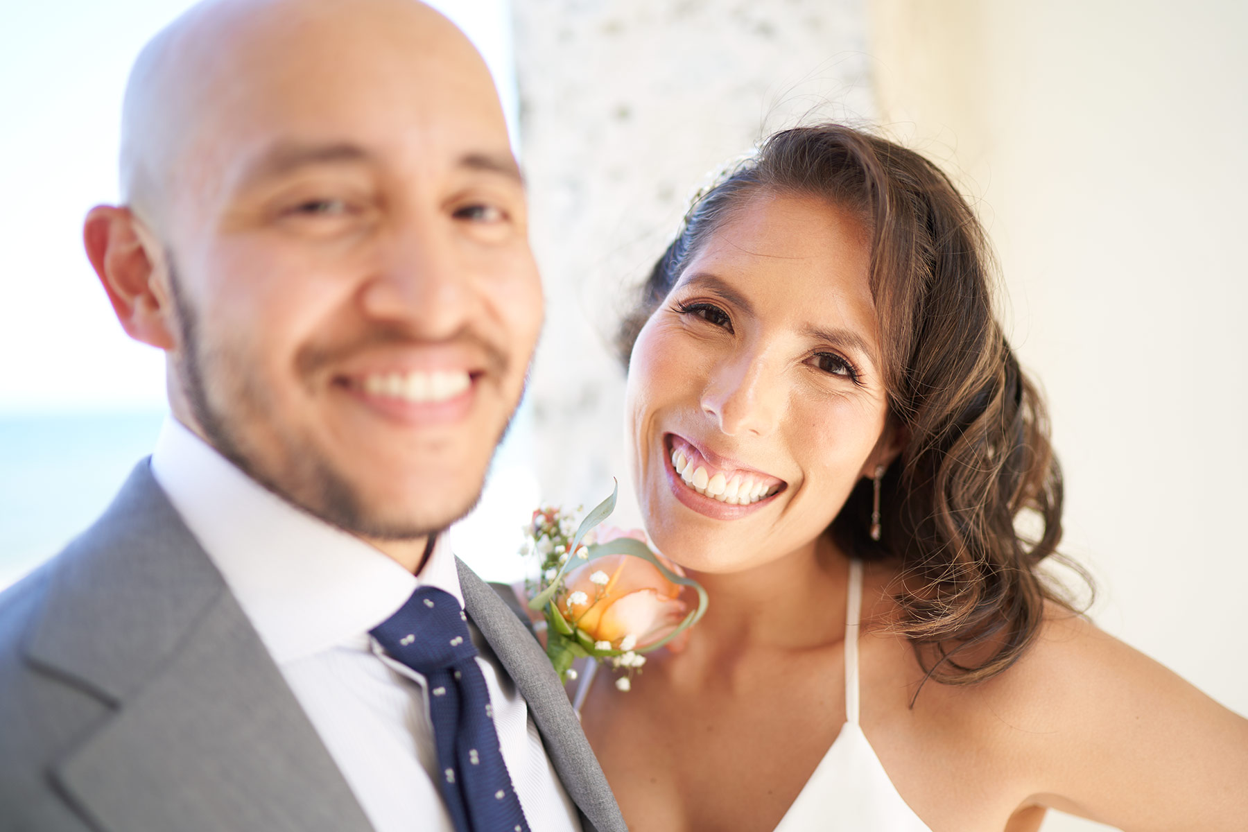 Young-Bride-and-groom-smiling-at-wedding